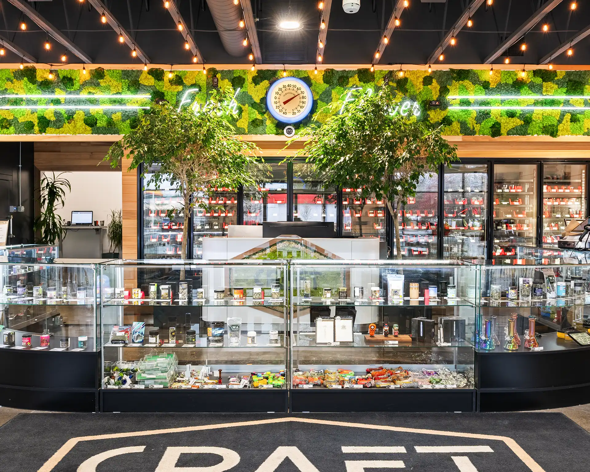 A Craft budtender helping a customer at the counter